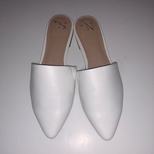Woman’s white open back flats